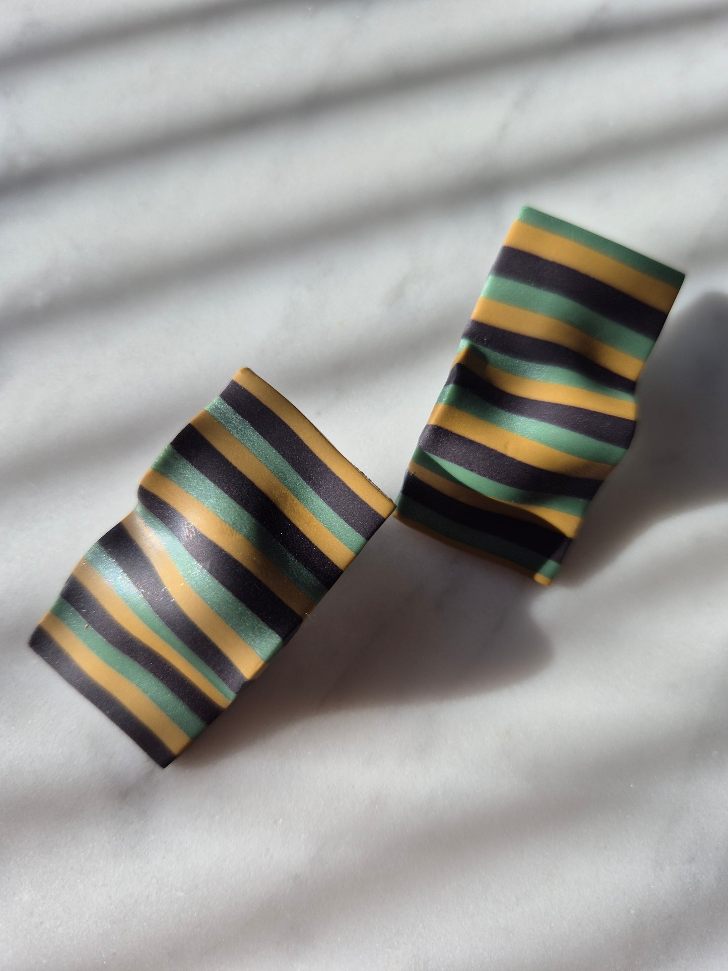 Stripe folded studs