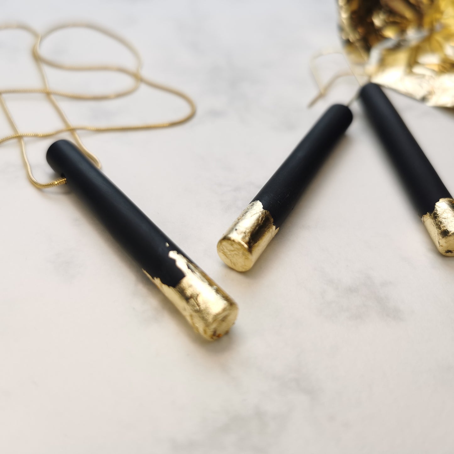 'Dipped' tube earrings.